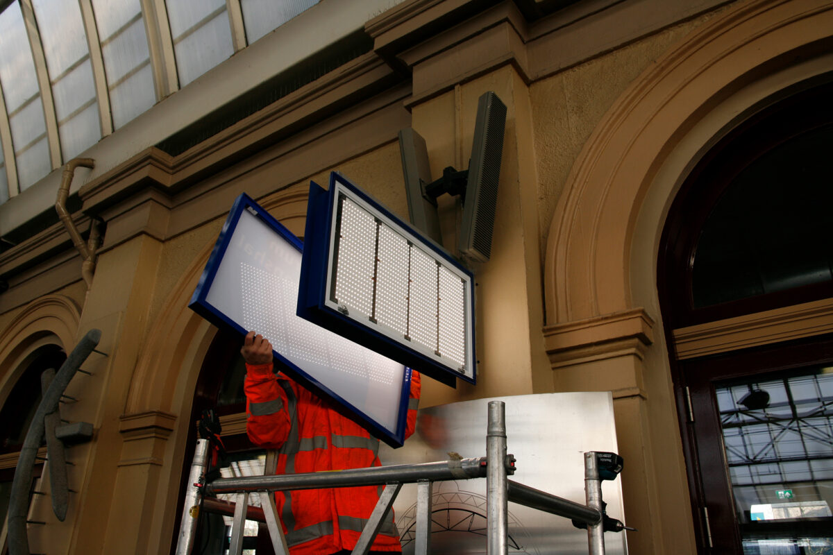 Prorail working on sign after retro-fit.